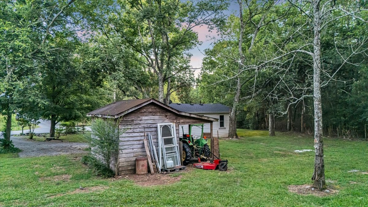 4204 Leanna Road Murfreesboro, TN 37129 - Photo 11 of 18 a front view of a house with a yard table and chairs