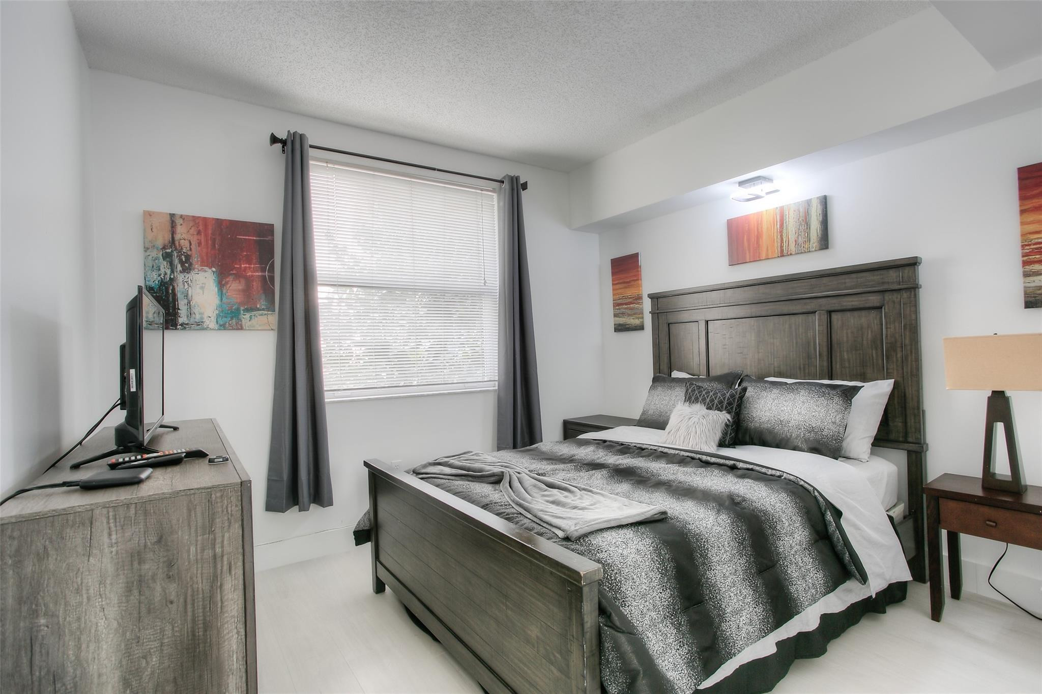17150 North Bay Road, Unit 2218 Sunny Isles Beach, FL 33160 - Photo 6 of 15 a bedroom with a bed and a window
