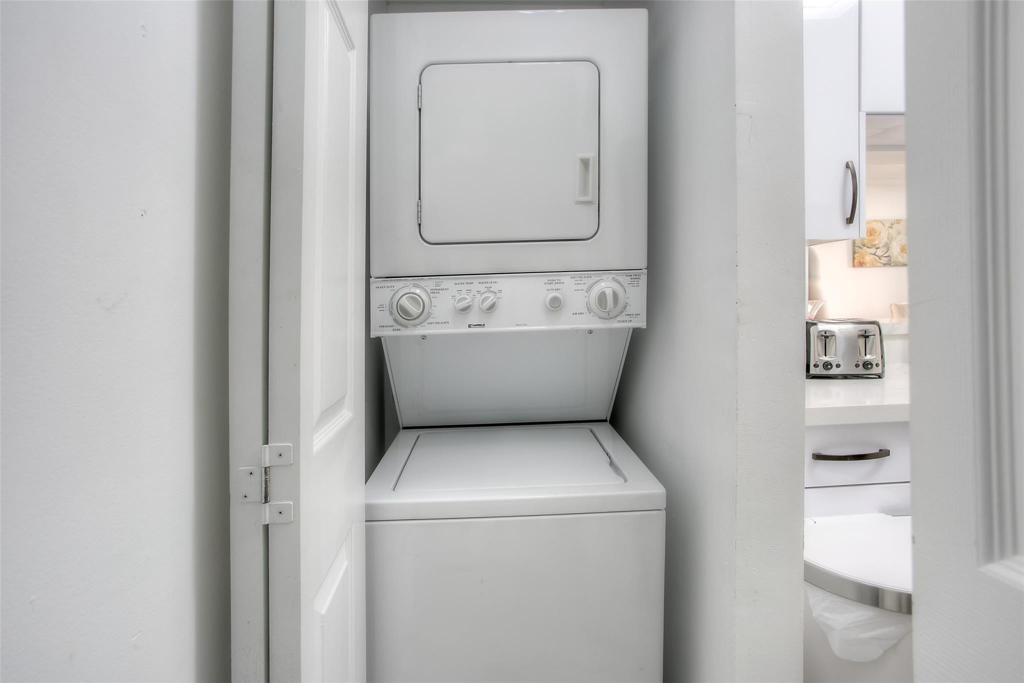 17150 North Bay Road, Unit 2218 Sunny Isles Beach, FL 33160 - Photo 10 of 15 a utility room with dryer and washer