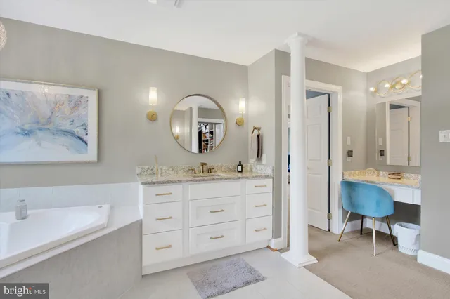 a bedroom with a bed a dresser and next to a window