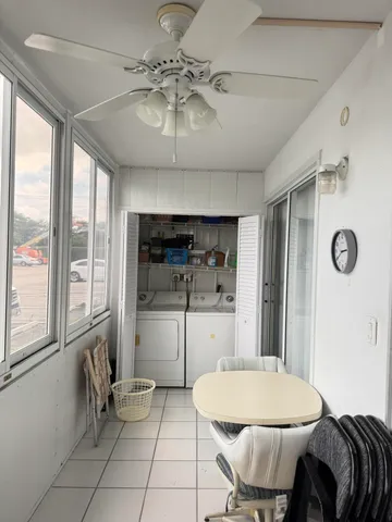 a kitchen with stainless steel appliances a refrigerator and microwave