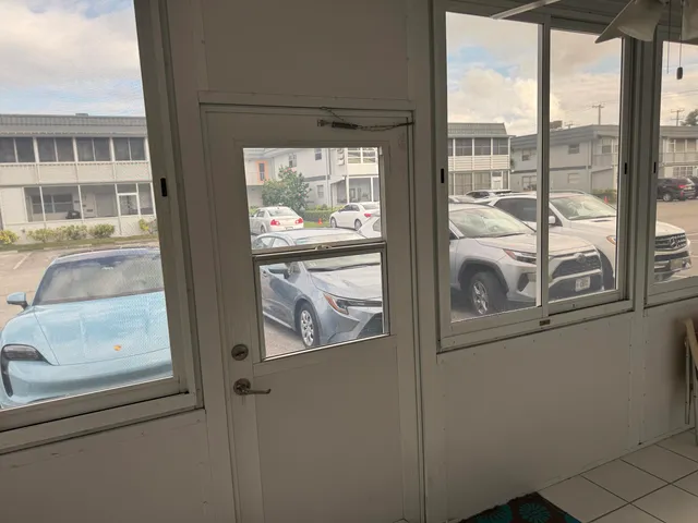 a view of a door and a window