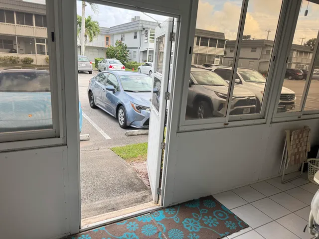 a view of living room with furniture and a floor to ceiling window