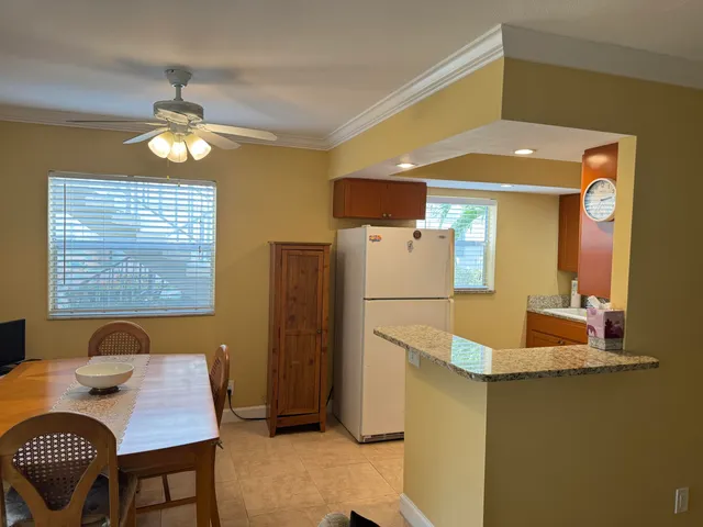 a workspace with furniture and chandelier