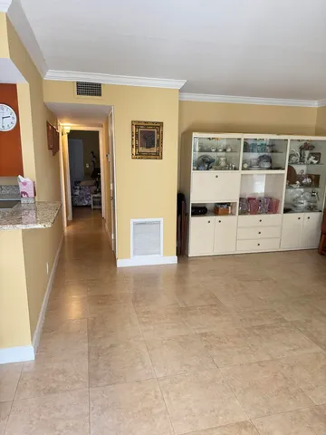 a view of a big room with furniture and window