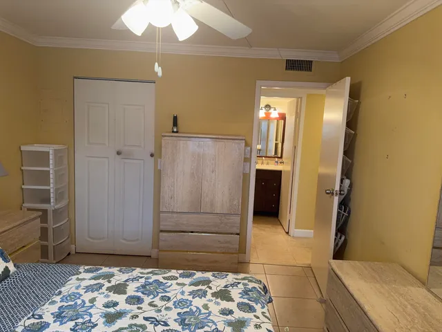 a bedroom with a bed and a dresser