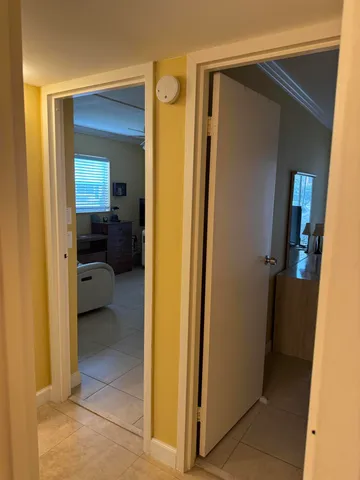 a view of a bedroom from a hallway