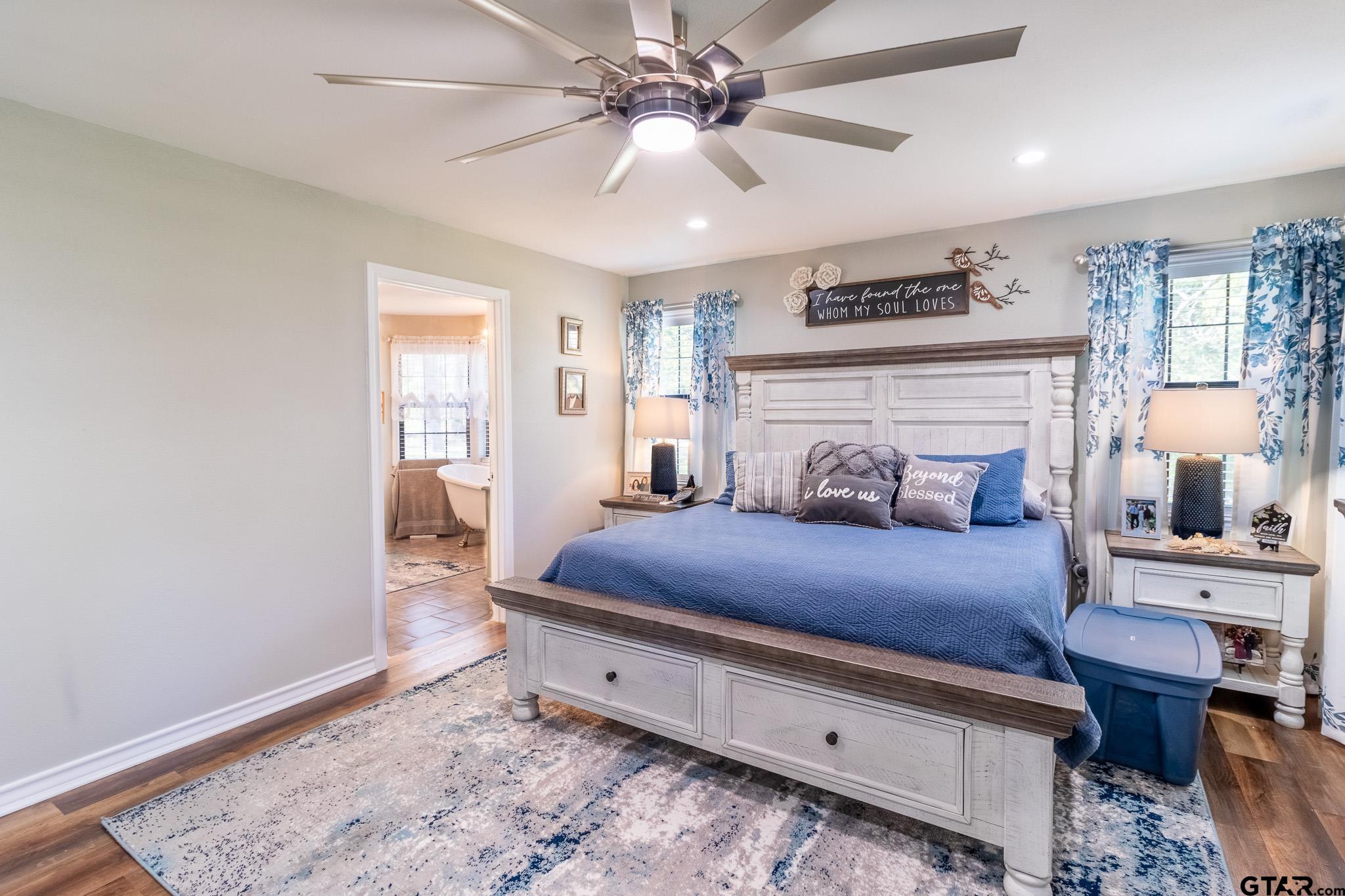 15540 State Highway 31 West Tyler, TX 75709 - Photo 22 of 37 a bedroom with a bed and wooden floor