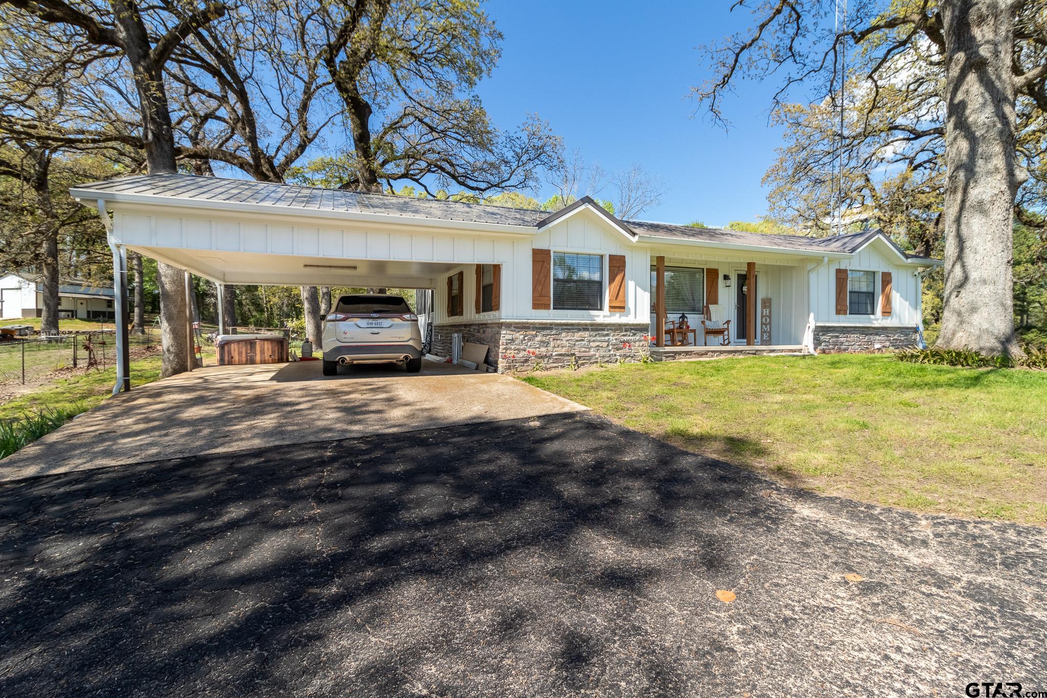 15540 State Highway 31 West Tyler, TX 75709 - Photo 37 of 37 a view of a house with a big yard and large trees