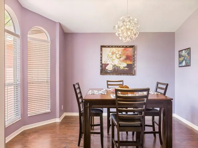 a dining room with furniture and window
