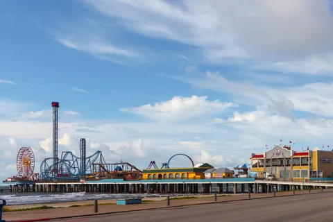 a view of a city with tall buildings and a pathway