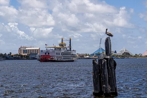 a front view of a residential apartment building with a yard