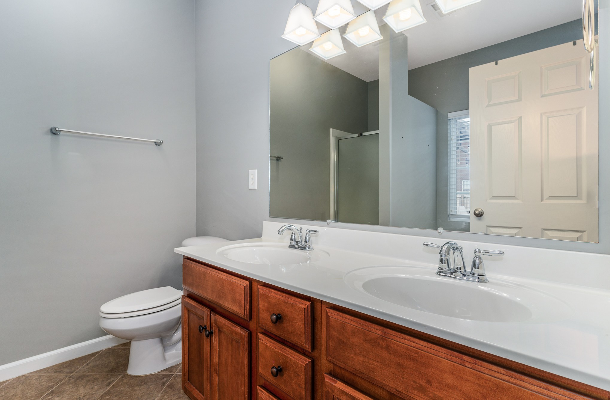 3002 Hope Circle Spring Hill, TN 37174 - Photo 15 of 25 a bathroom with a sink a toilet and a mirror