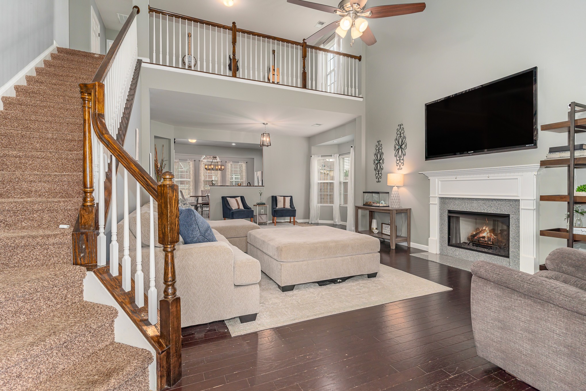 3002 Hope Circle Spring Hill, TN 37174 - Photo 3 of 25 a living room with a fireplace and a flat screen tv
