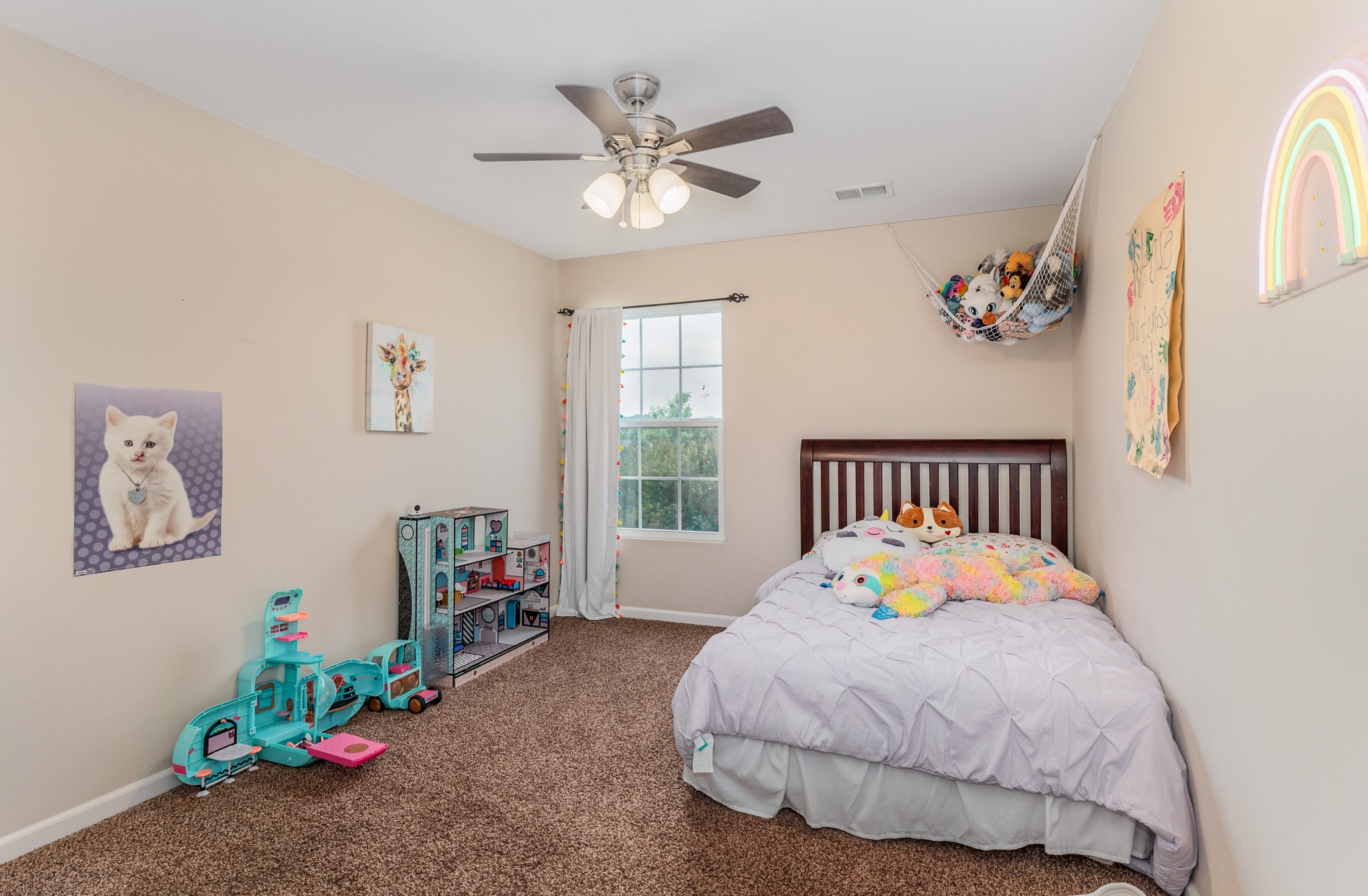 3002 Hope Circle Spring Hill, TN 37174 - Photo 21 of 25 a bedroom with a bed and a chandelier