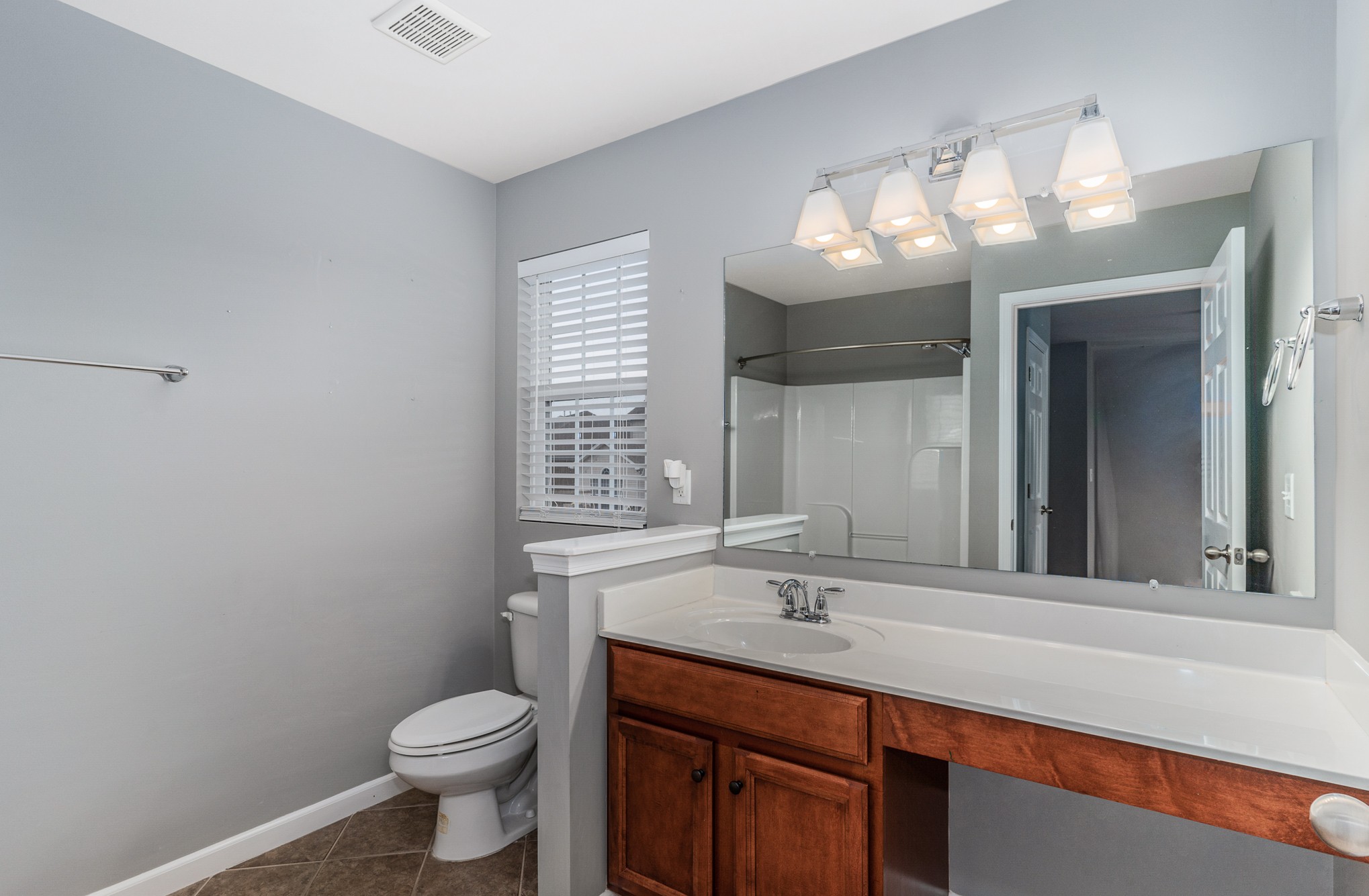 3002 Hope Circle Spring Hill, TN 37174 - Photo 22 of 25 a bathroom with a sink vanity and a toilet