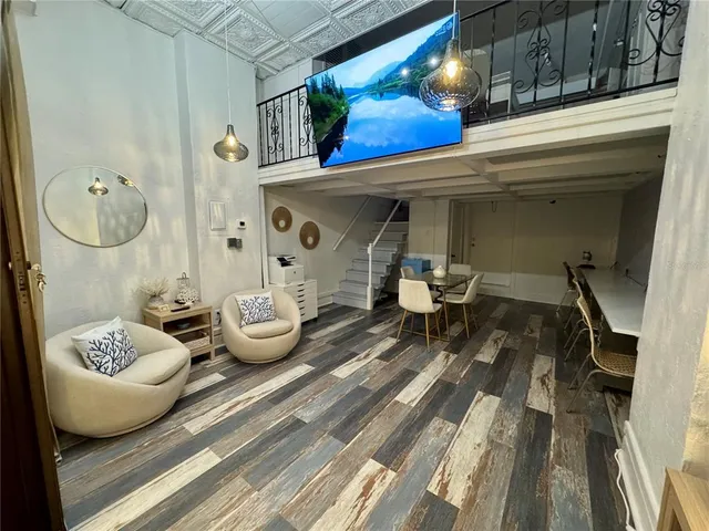 a living room with furniture and a rug