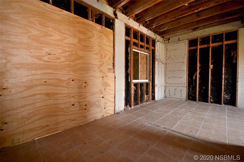 6829 Turtlemound Road New Smyrna Beach, FL 32169 - Photo 11 of 38 a view of an empty room