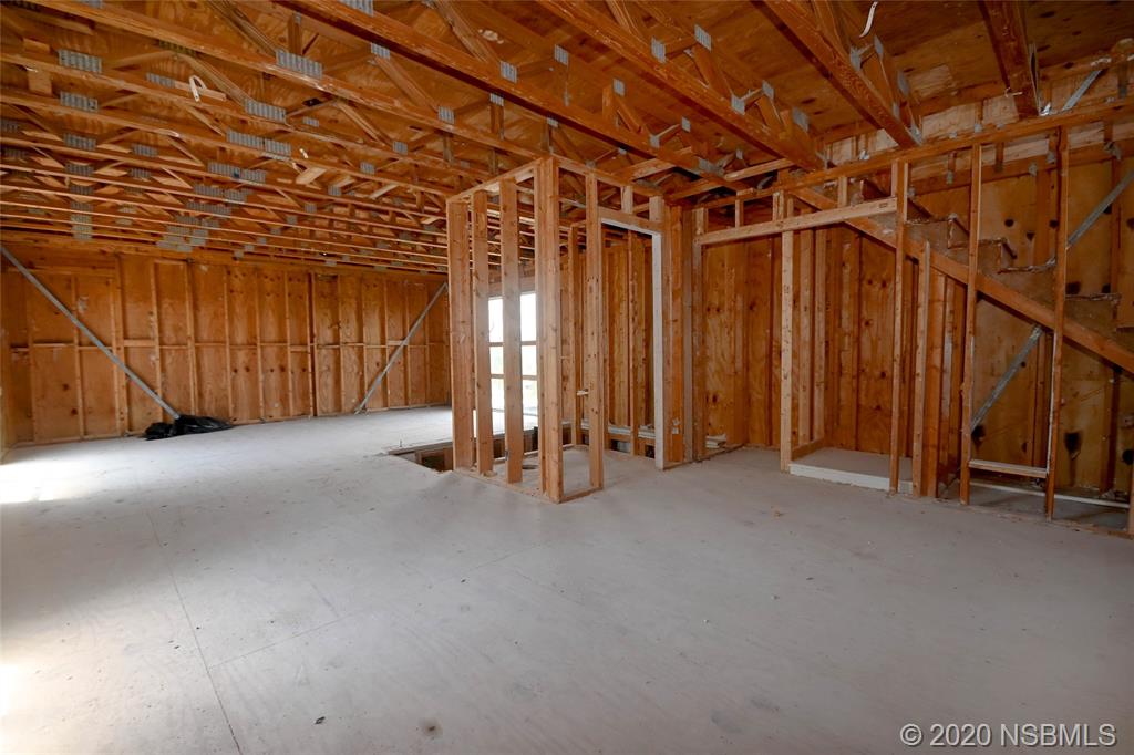 6829 Turtlemound Road New Smyrna Beach, FL 32169 - Photo 16 of 38 a view of a room with stairs