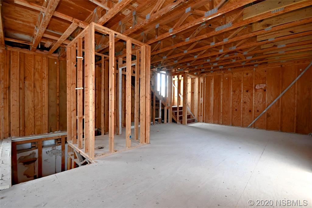 6829 Turtlemound Road New Smyrna Beach, FL 32169 - Photo 17 of 38 a view of an empty room with a window