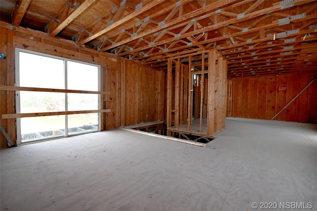 6829 Turtlemound Road New Smyrna Beach, FL 32169 - Photo 18 of 38 a view of an empty room with a windows