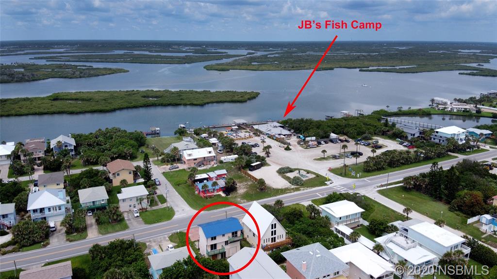 6829 Turtlemound Road New Smyrna Beach, FL 32169 - Photo 3 of 38 an aerial view of a house with outdoor space