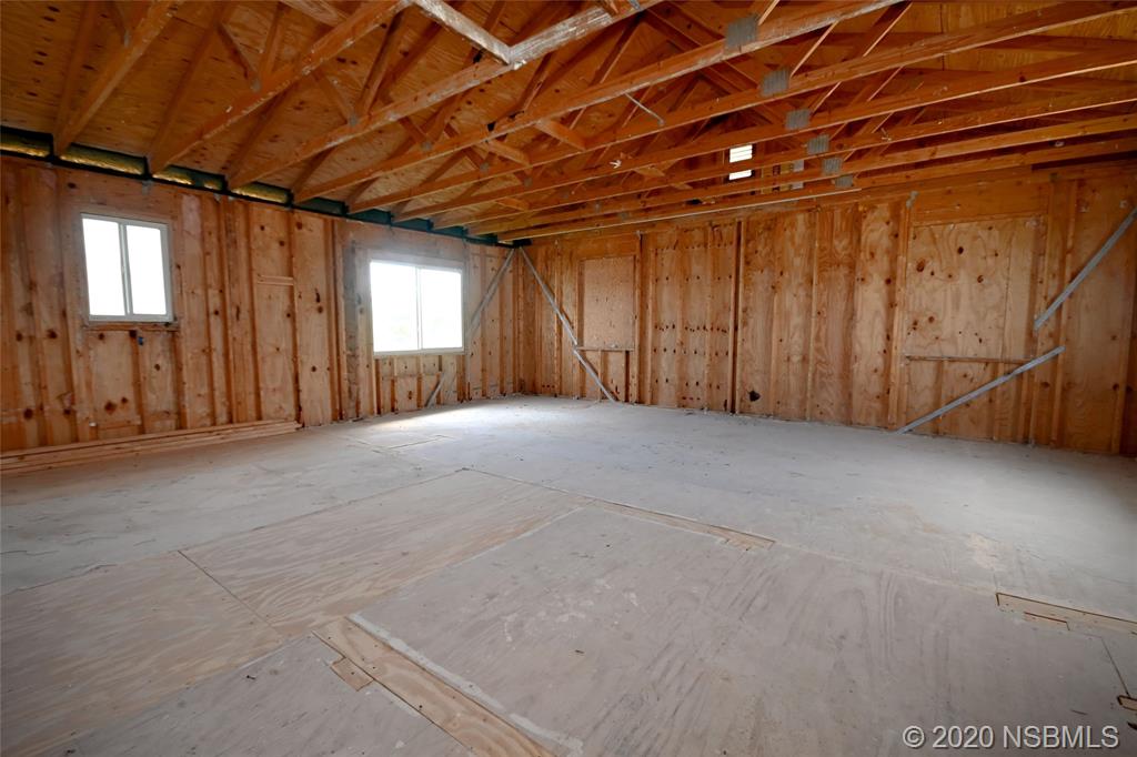 6829 Turtlemound Road New Smyrna Beach, FL 32169 - Photo 23 of 38 a view of an empty room