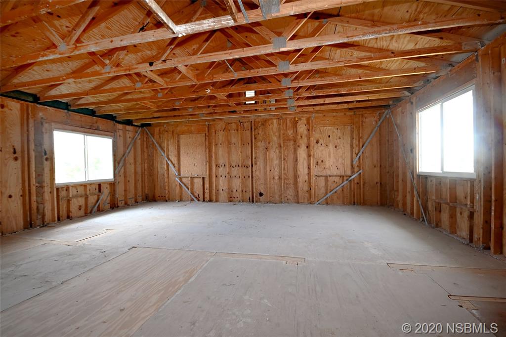 6829 Turtlemound Road New Smyrna Beach, FL 32169 - Photo 25 of 38 a view of an empty room