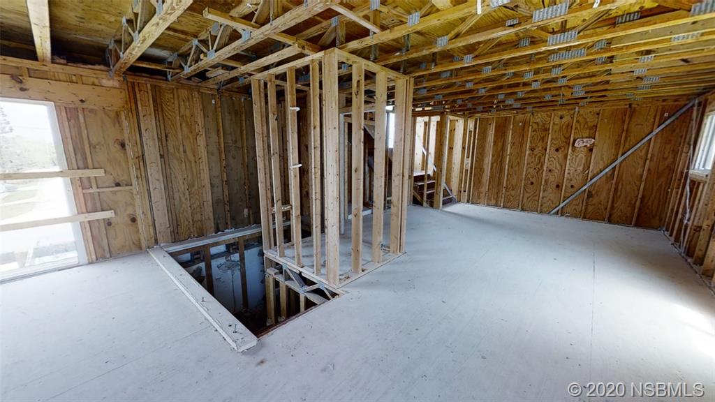 6829 Turtlemound Road New Smyrna Beach, FL 32169 - Photo 35 of 38 a view of an empty room with stairs