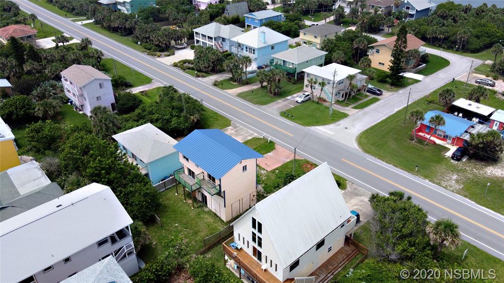 6829 Turtlemound Road New Smyrna Beach, FL 32169 - Photo 5 of 38 an aerial view of a house