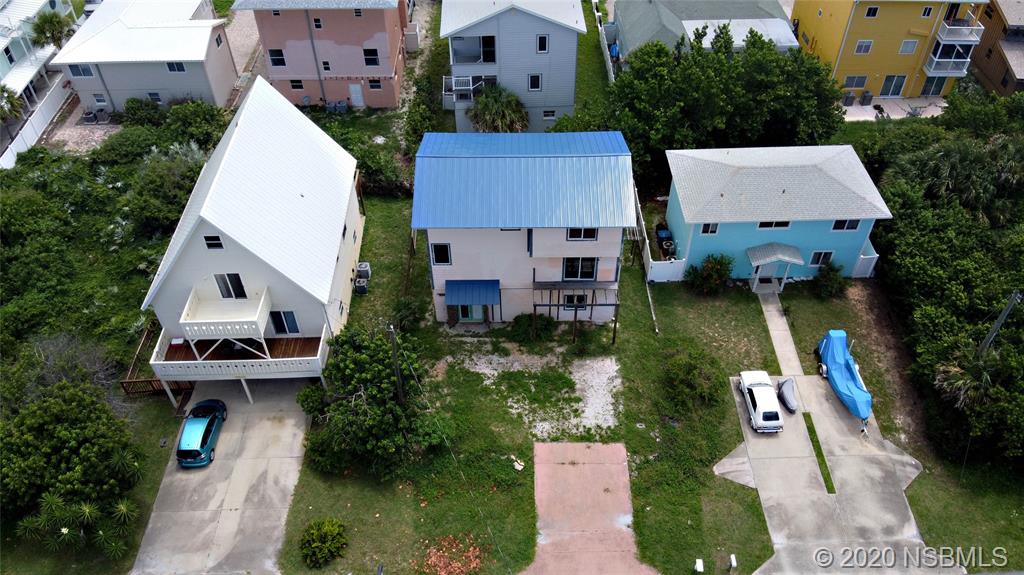 6829 Turtlemound Road New Smyrna Beach, FL 32169 - Photo 7 of 38 an aerial view of a house