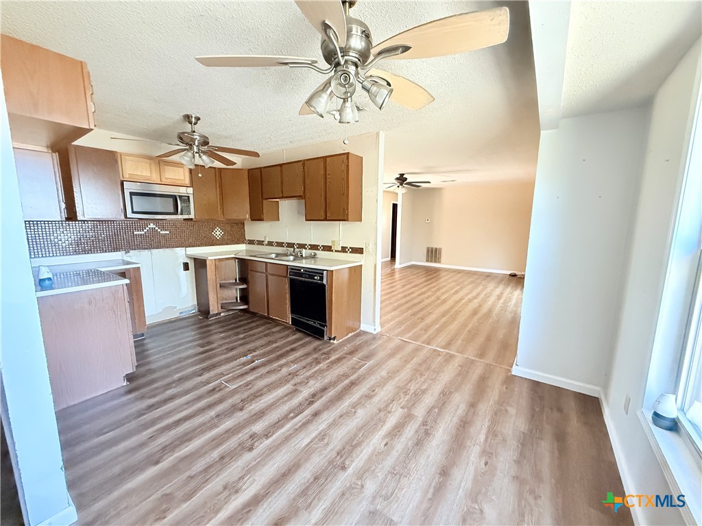 4700 Old Howard Road Temple, TX 76504 - Photo 11 of 33 a view of kitchen with sink microwave and stove