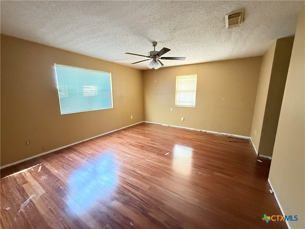 4700 Old Howard Road Temple, TX 76504 - Photo 16 of 33 wooden floor in an empty room with a window