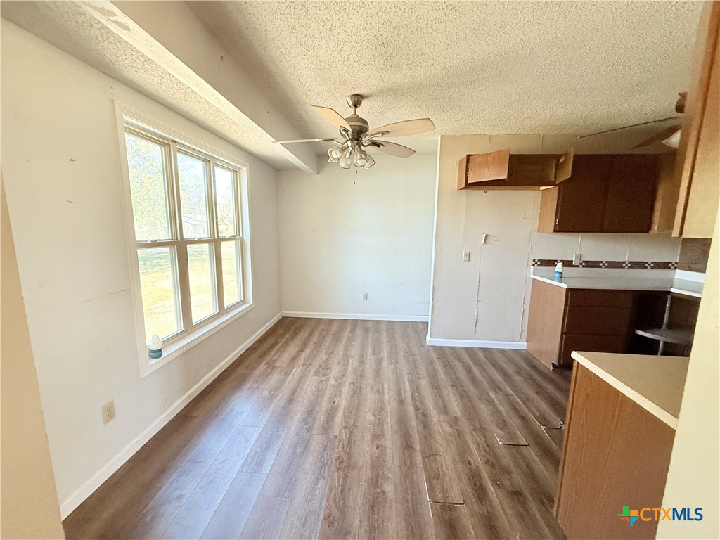 4700 Old Howard Road Temple, TX 76504 - Photo 8 of 33 wooden floor in an empty room with a window