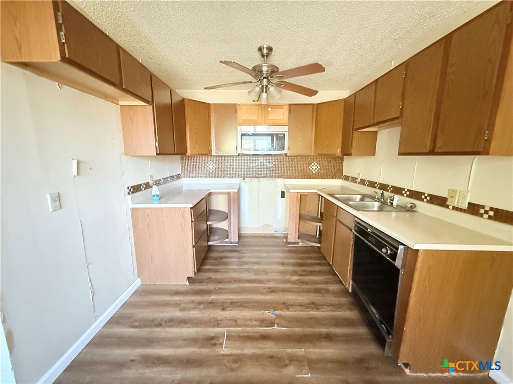 4700 Old Howard Road Temple, TX 76504 - Photo 9 of 33 a large kitchen with stainless steel appliances granite countertop a sink stove and refrigerator