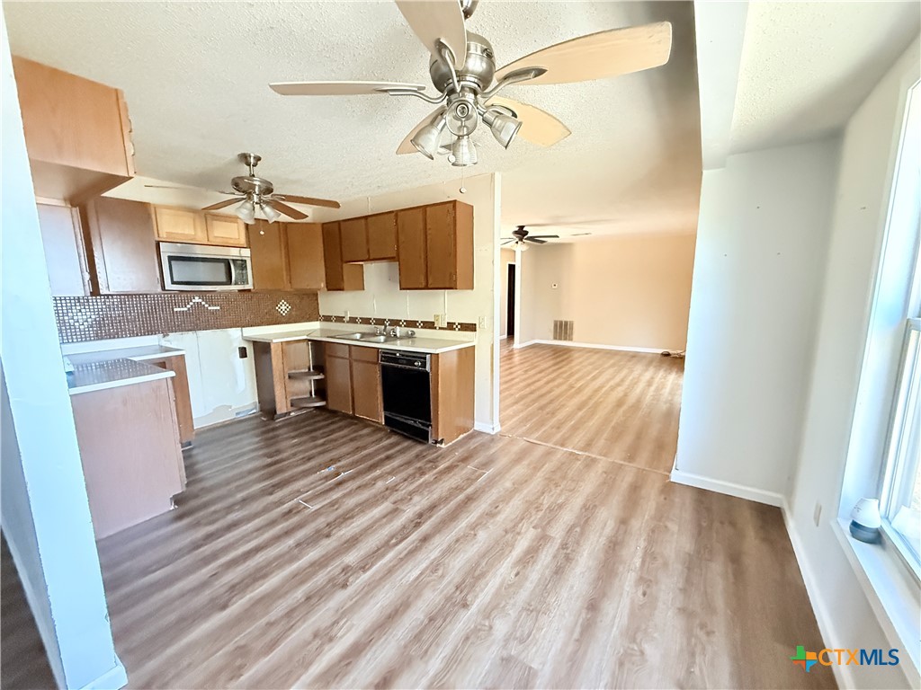 4700 Old Howard Road Temple, TX 76504 - Photo 10 of 33 a view of kitchen with sink microwave and stove
