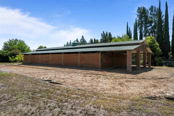 a backyard of a house with lots of green space