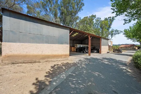 a view of street with parked cars
