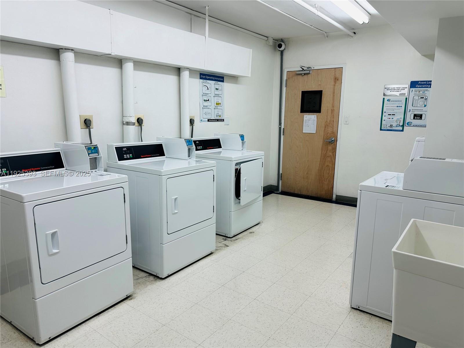 100 Lincoln Road, Unit 1427 Miami Beach, FL 33139 - Photo 21 of 30 a utility room with dryer and washer