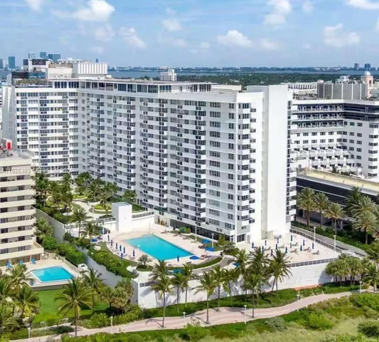 a view of a swimming pool with an outdoor seating