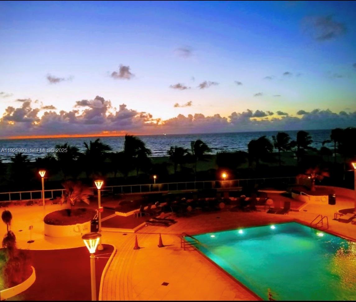 100 Lincoln Road, Unit 1427 Miami Beach, FL 33139 - Photo 25 of 30 a view of a swimming pool with an outdoor seating
