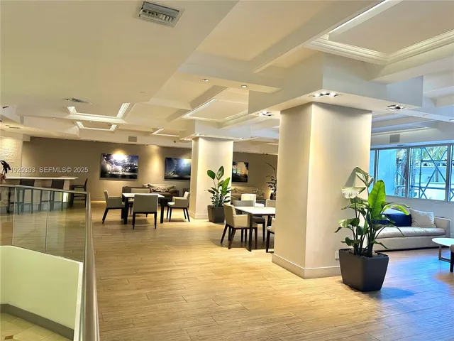 a bedroom with 2 bed and a lamp on table