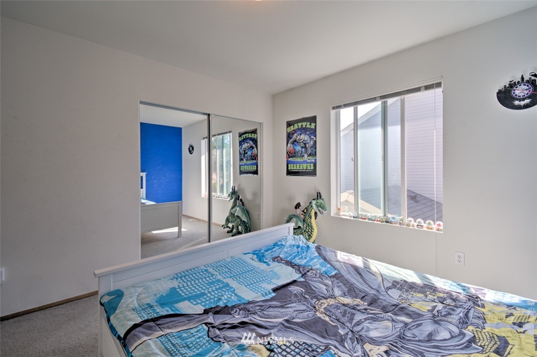 3114 Southeast 3rd Street Renton, WA 98056 - Photo 15 of 25 a bedroom with a bed and a window
