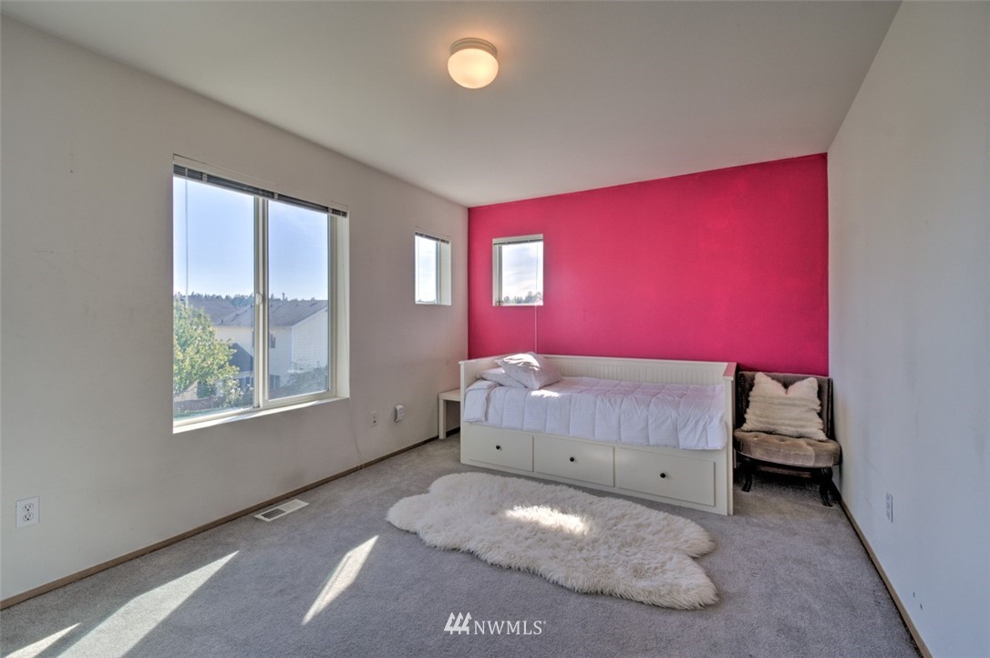 3114 Southeast 3rd Street Renton, WA 98056 - Photo 16 of 25 a bedroom with a bed and a window