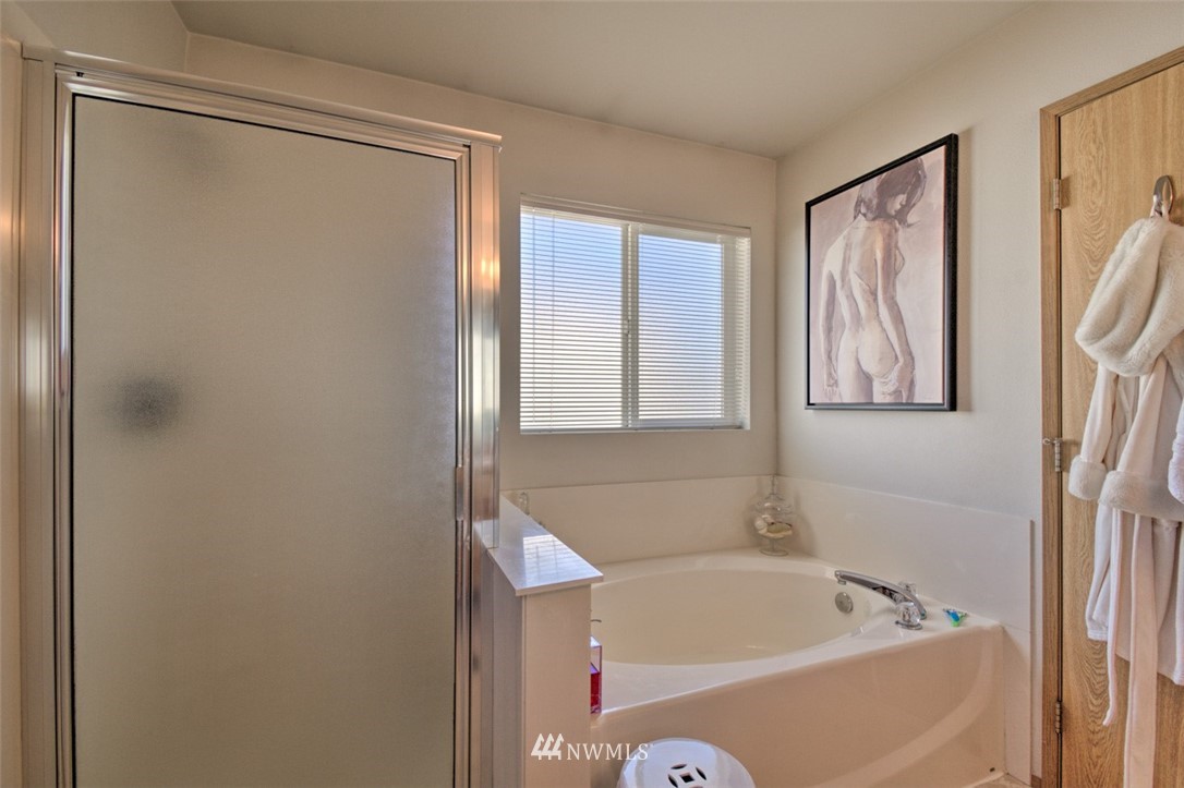 3114 Southeast 3rd Street Renton, WA 98056 - Photo 21 of 25 a bathroom with a bathtub and a shower