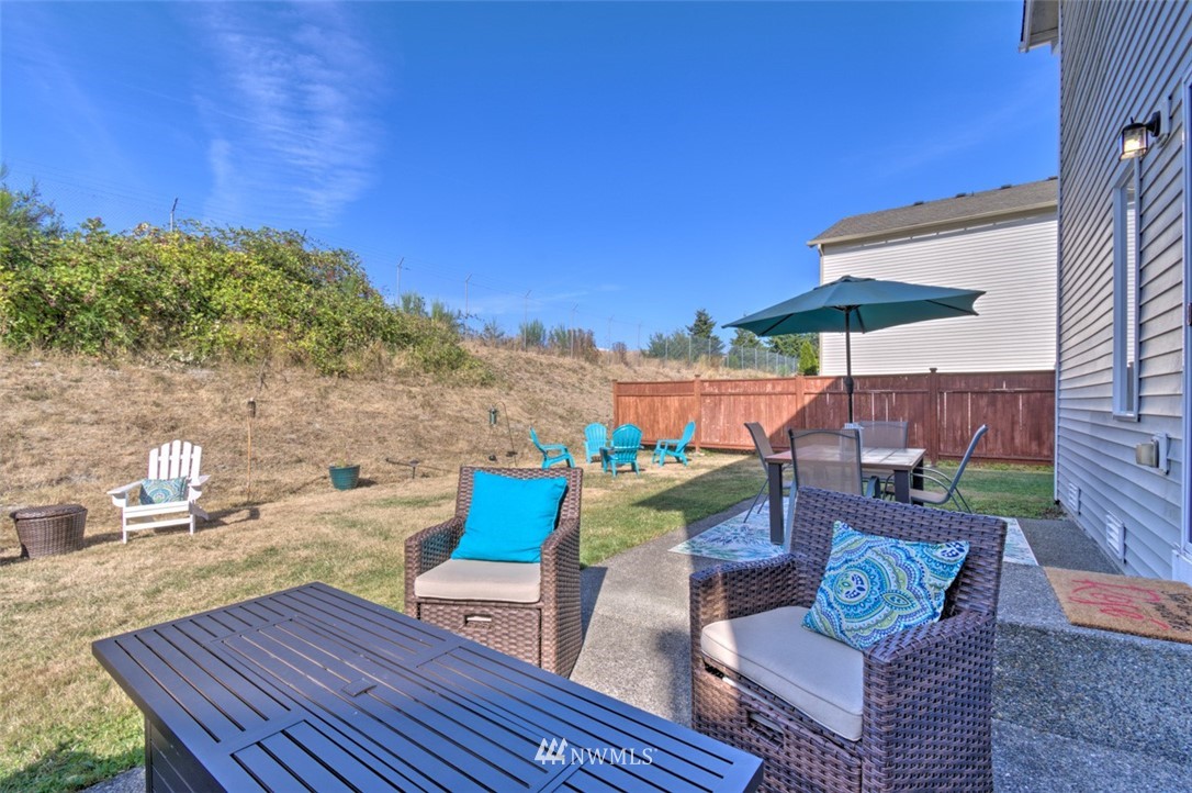 3114 Southeast 3rd Street Renton, WA 98056 - Photo 22 of 25 a view of a table and chairs on the roof deck