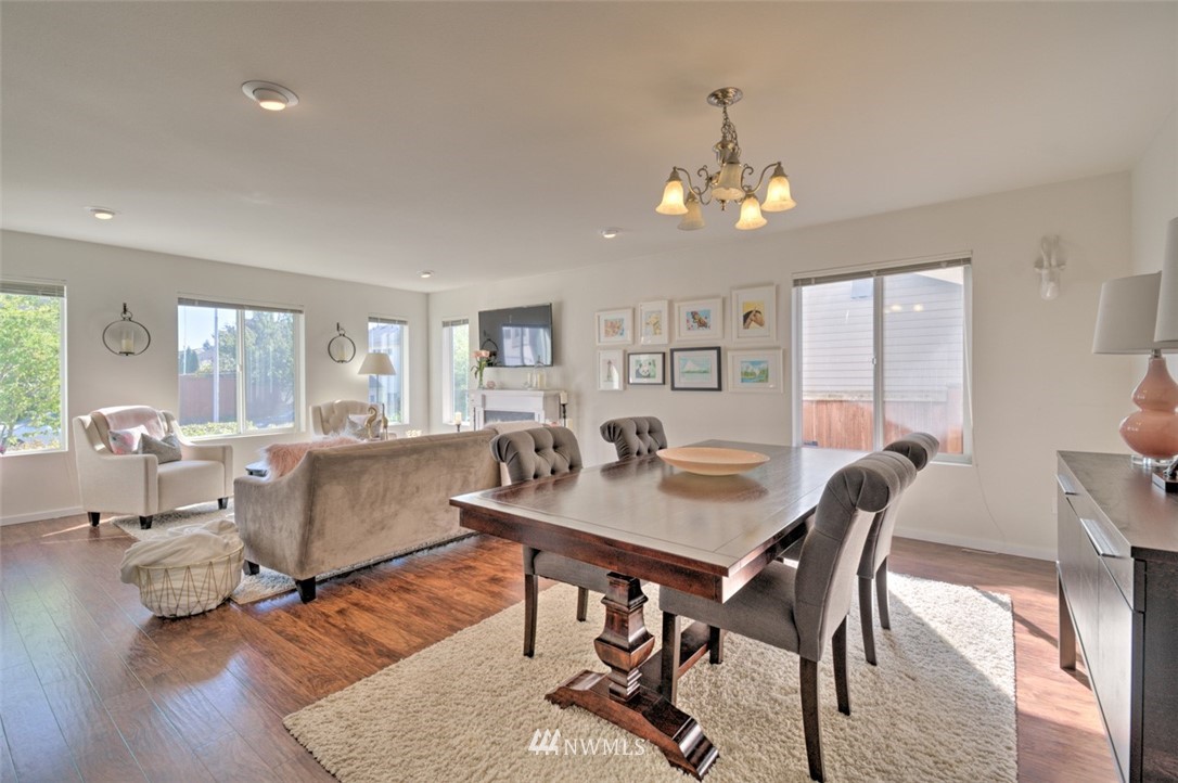 3114 Southeast 3rd Street Renton, WA 98056 - Photo 5 of 25 a view of a dining room with furniture window and wooden floor
