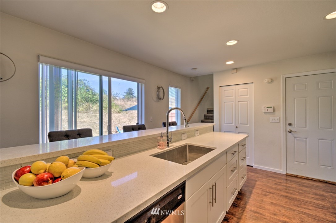 3114 Southeast 3rd Street Renton, WA 98056 - Photo 8 of 25 a kitchen with a sink and large windows