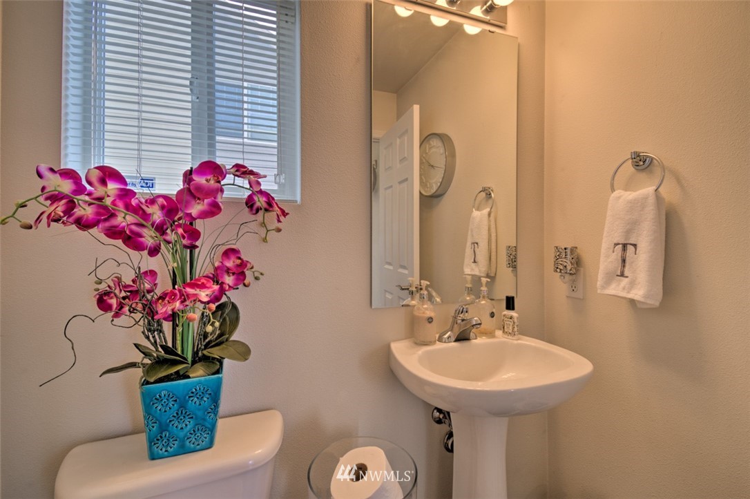 3114 Southeast 3rd Street Renton, WA 98056 - Photo 10 of 25 a bathroom with a sink mirror and vanity