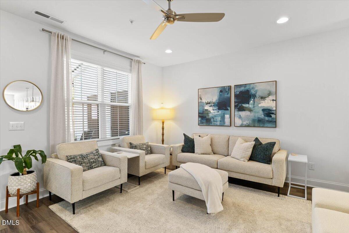 6810 Milligan Way, Unit 103 Raleigh, NC 27613 - Photo 18 of 37 a living room with furniture and a large window
